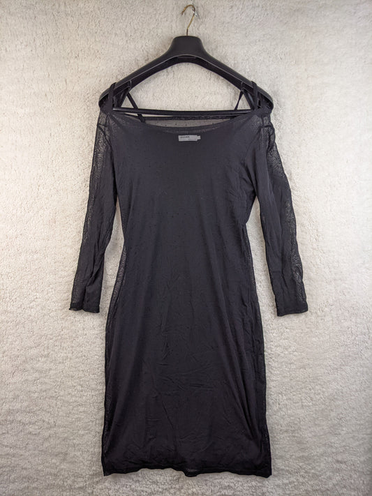 Front view of black sheer dress with polka dots