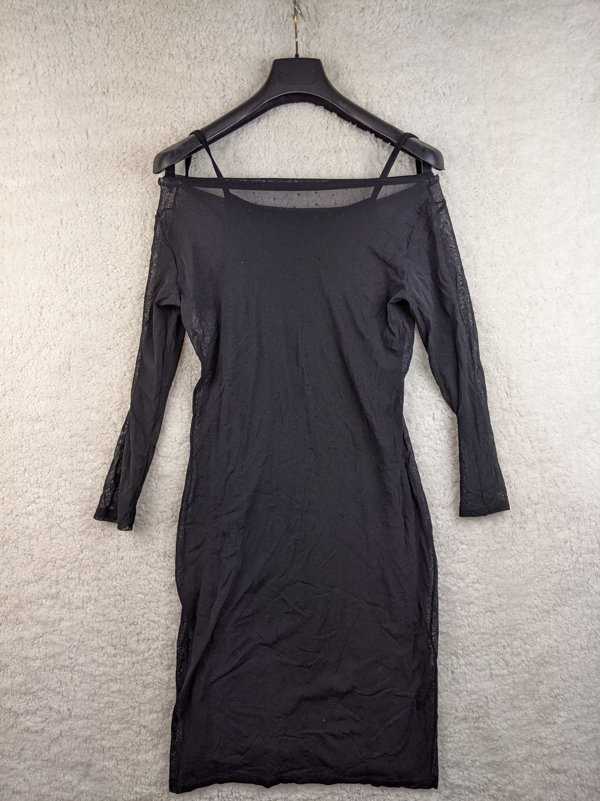 Back view of black sheer dress with polka dots