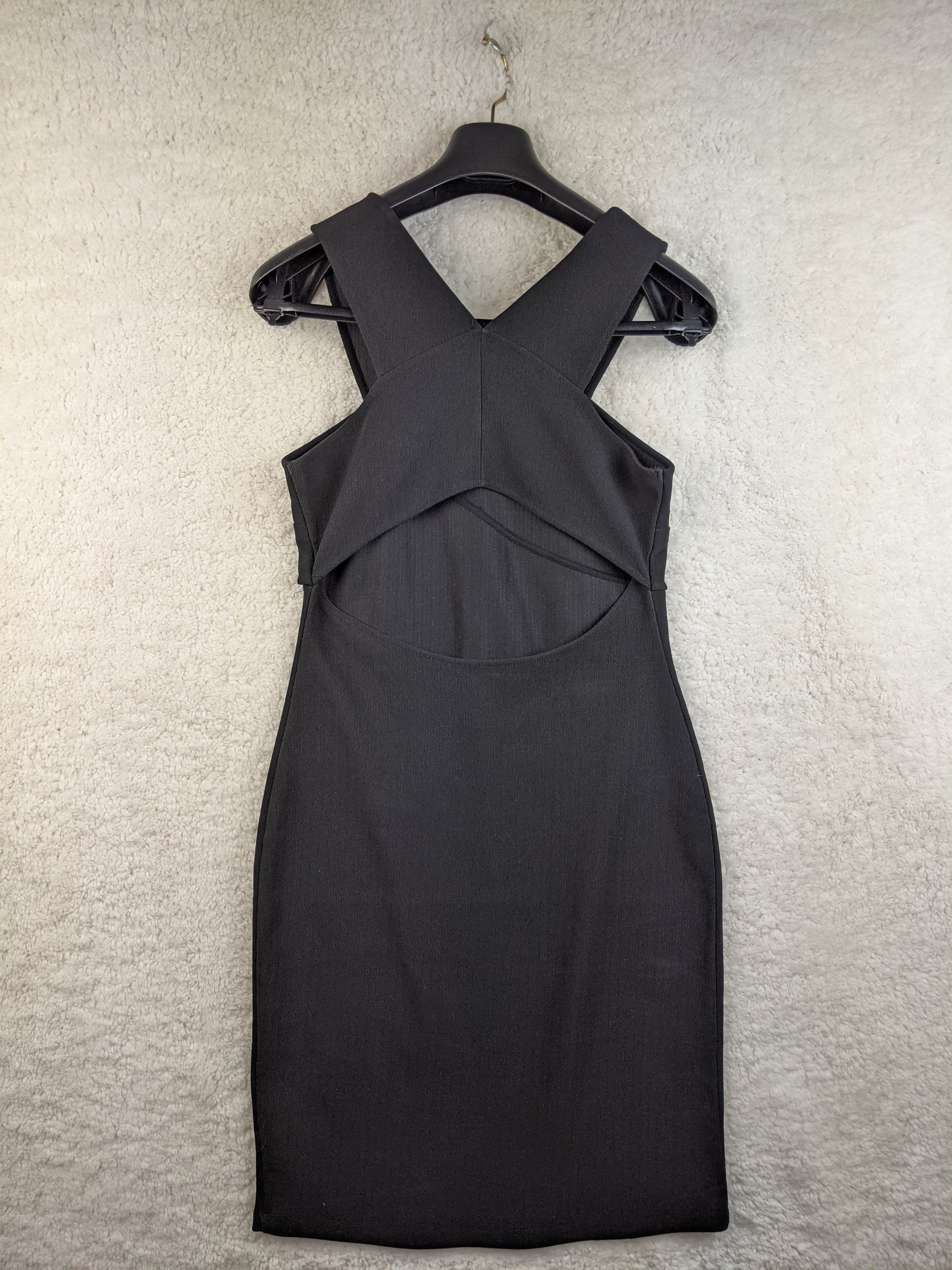Back view of black twist front dress