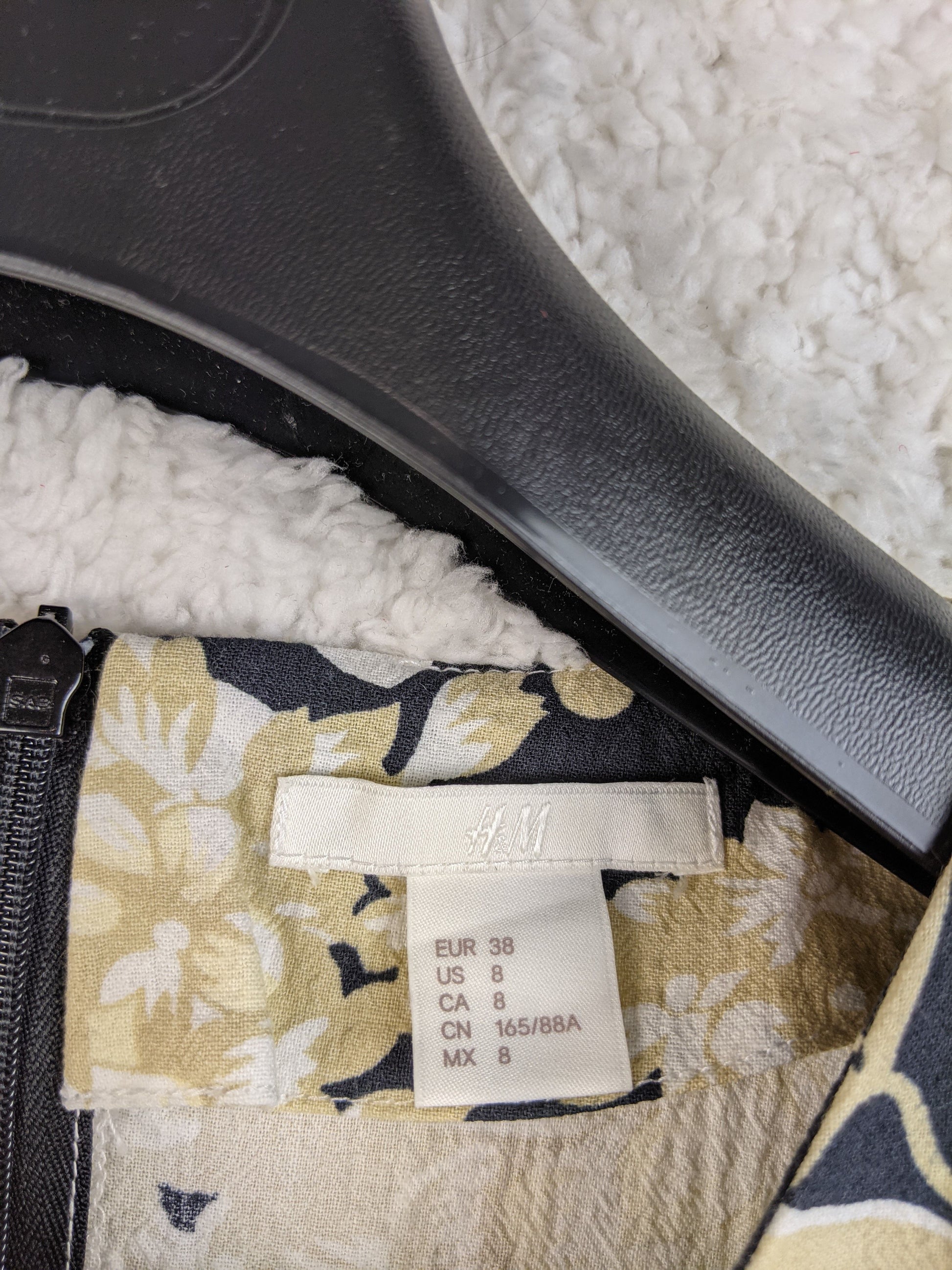 H&M dress size tag showing EUR 38