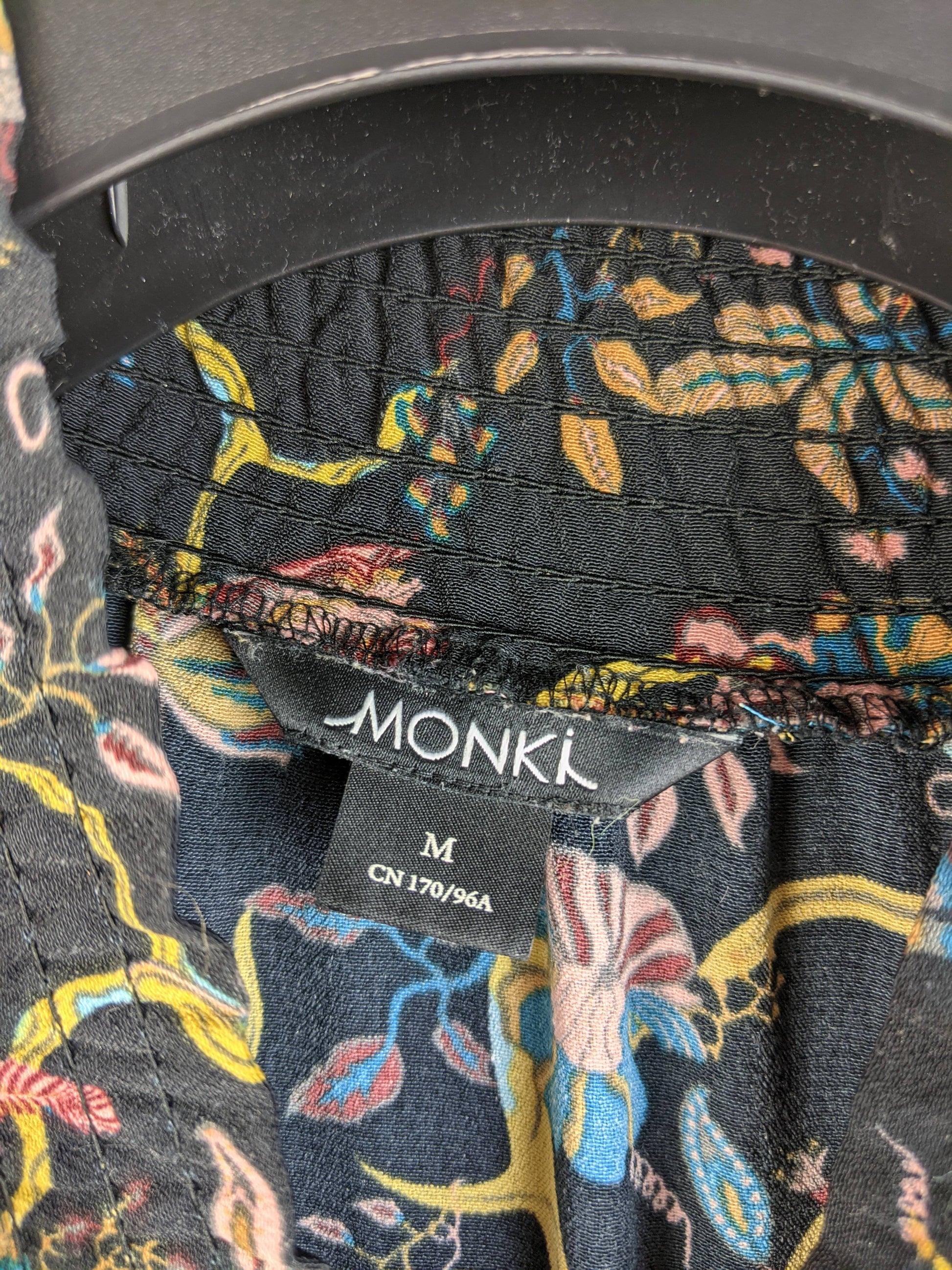 Monki dress label showing size Medium