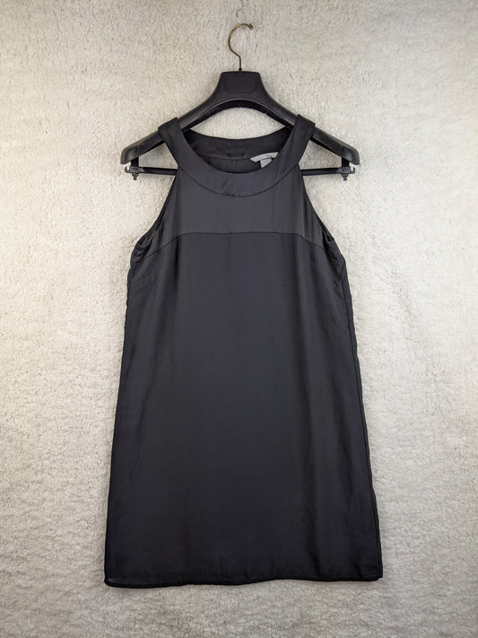 Front view of black sleeveless dress on a hanger
