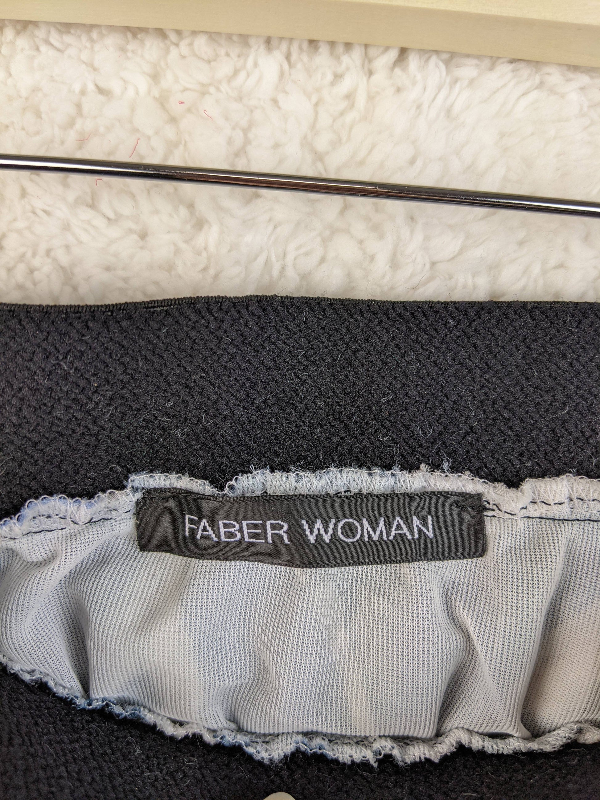 Faber Woman brand tag