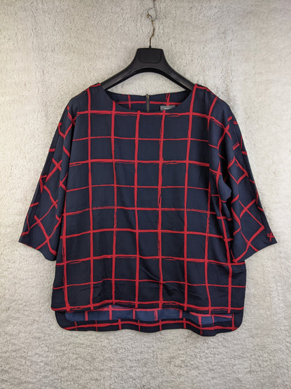 Navy and red checkered blouse on hanger - front view