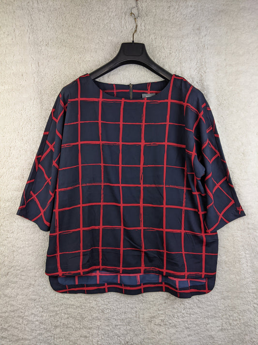 Navy and red checkered blouse on hanger - front view