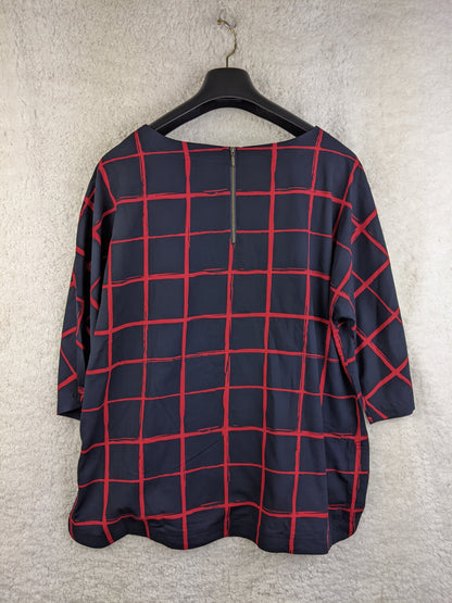 Navy and red checkered blouse on hanger - back view