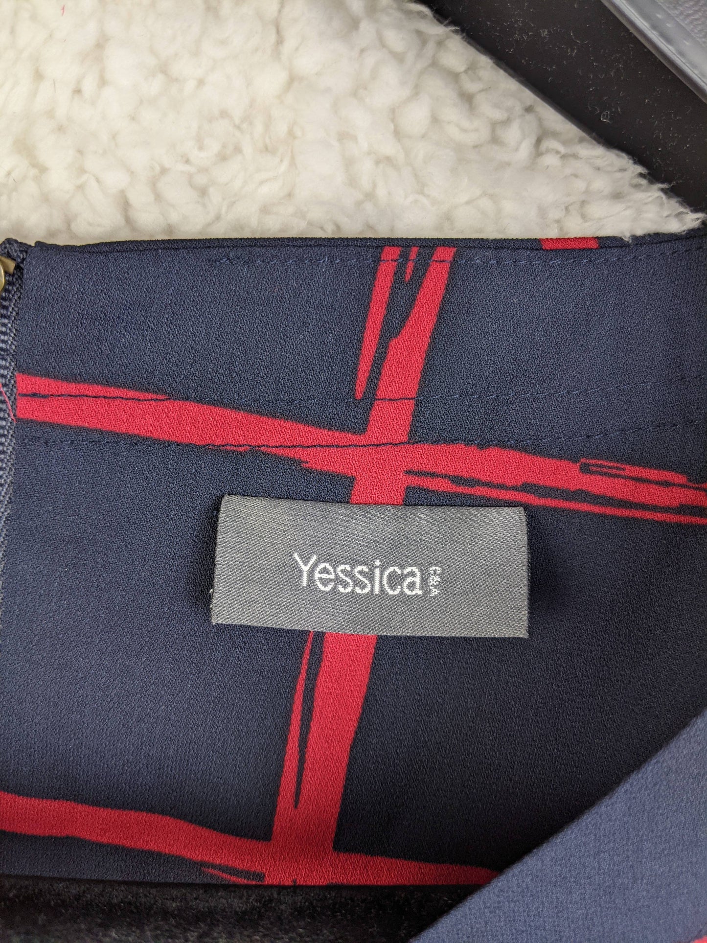 Yessica brand label on blouse