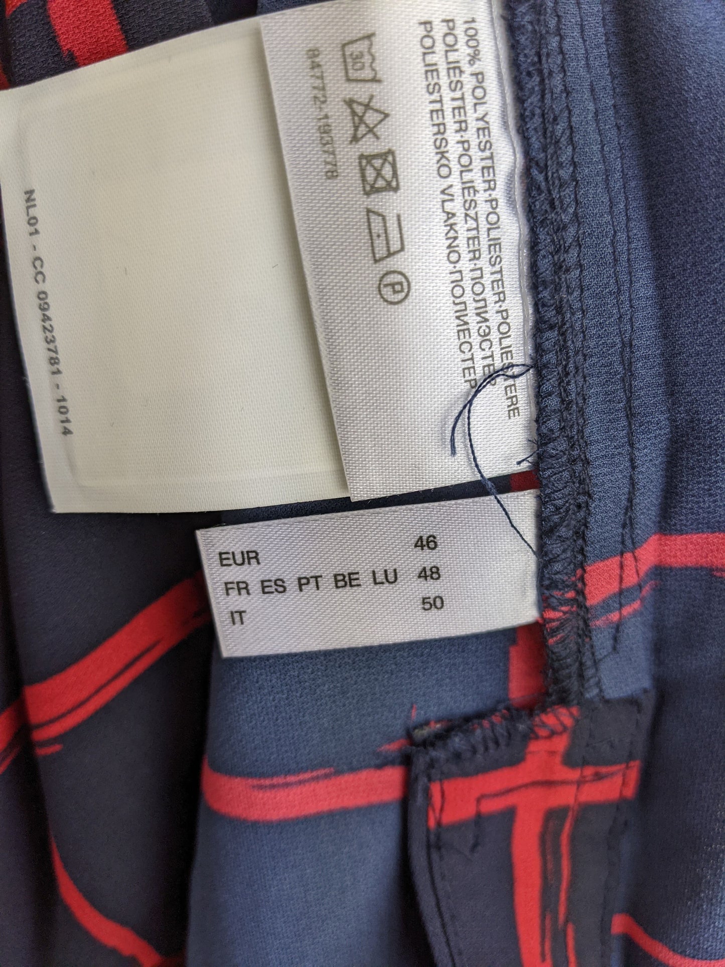Clothing tag showing size and material information