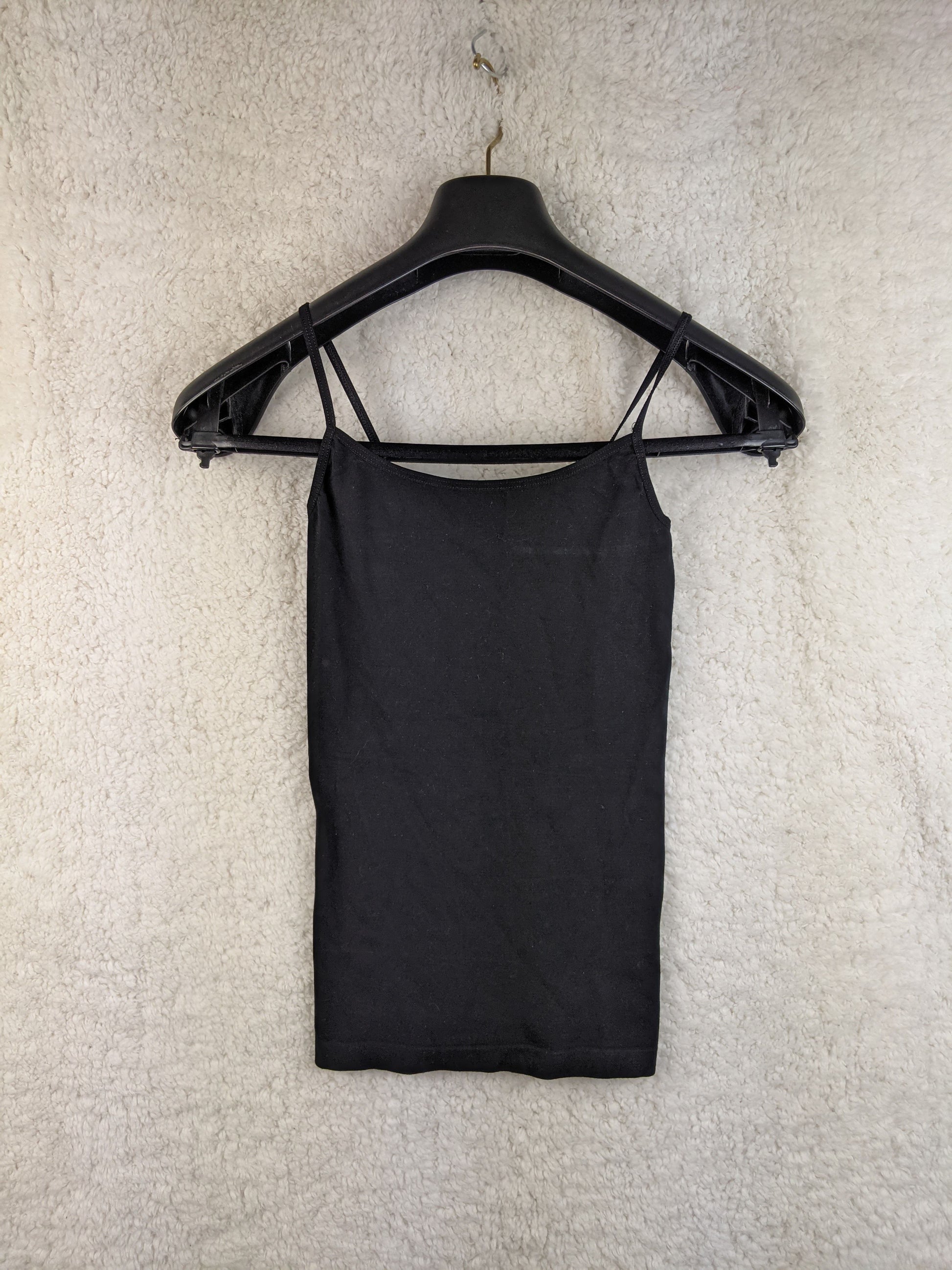 Black spaghetti strap top on hanger