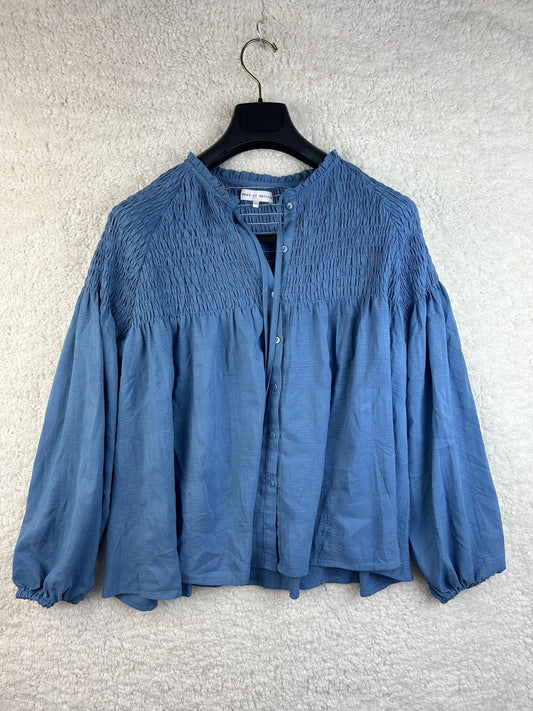 Front view of Dash of Daring blue smocked blouse