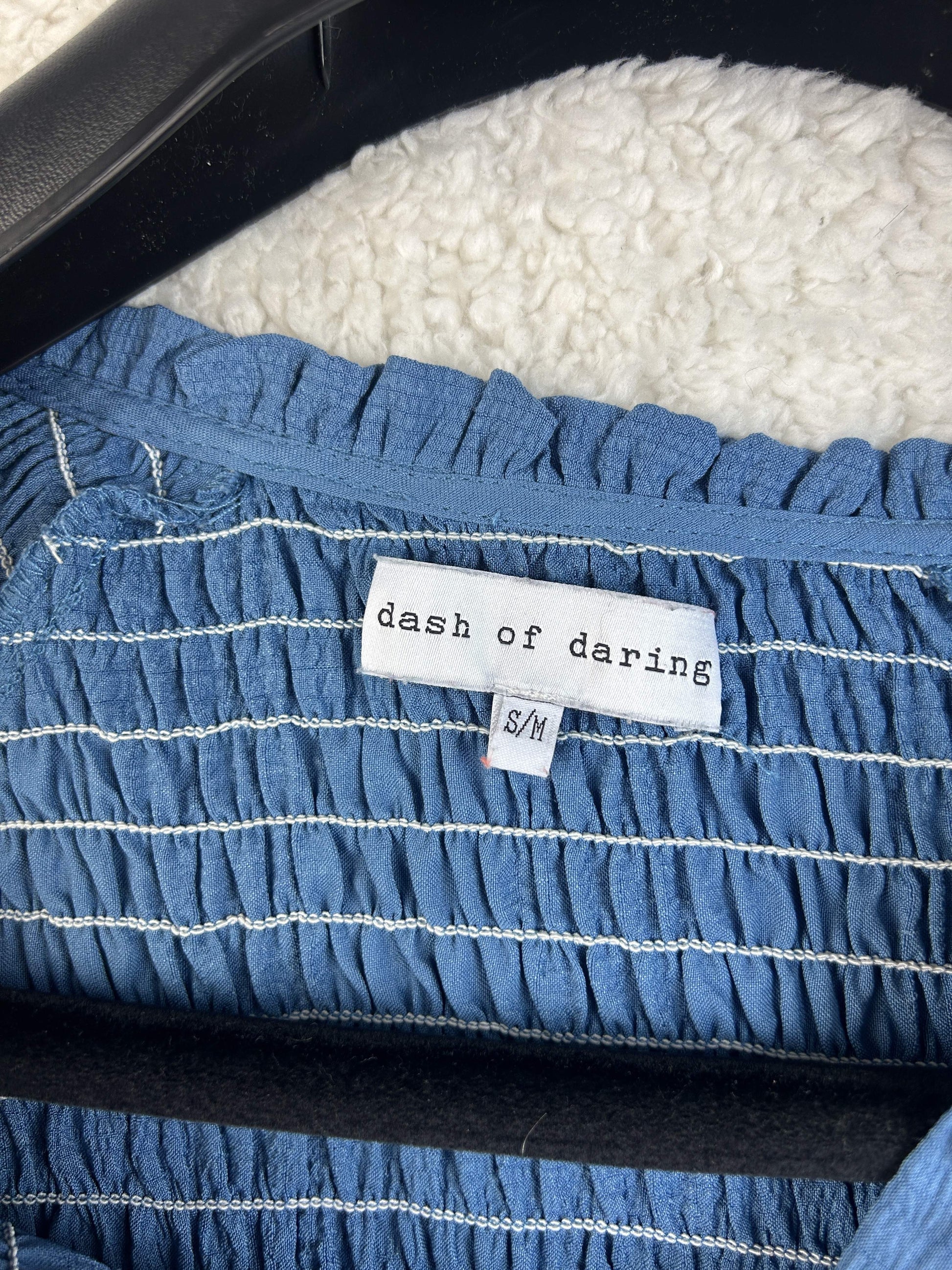 Close-up of Dash of Daring label in blouse