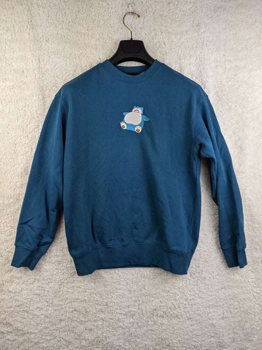Front view of blue sweatshirt with Pokémon design