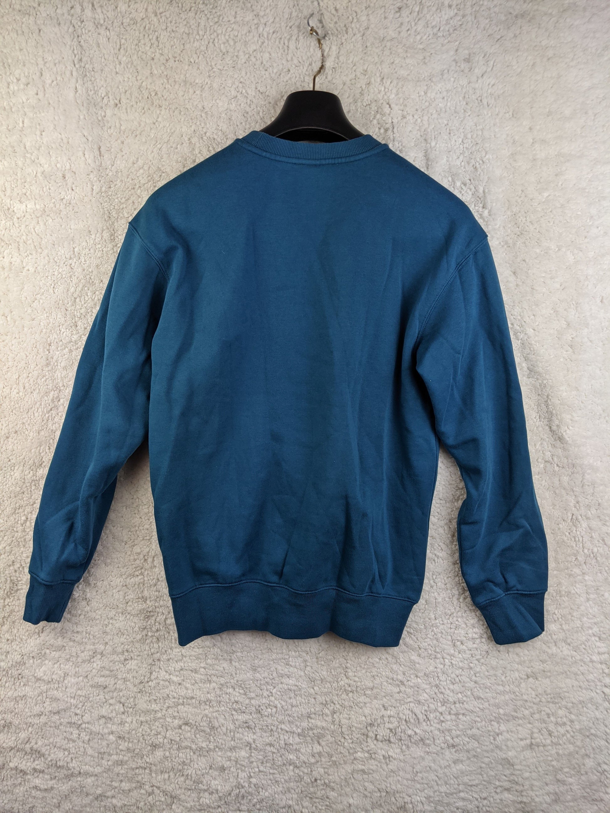 Back view of blue sweatshirt