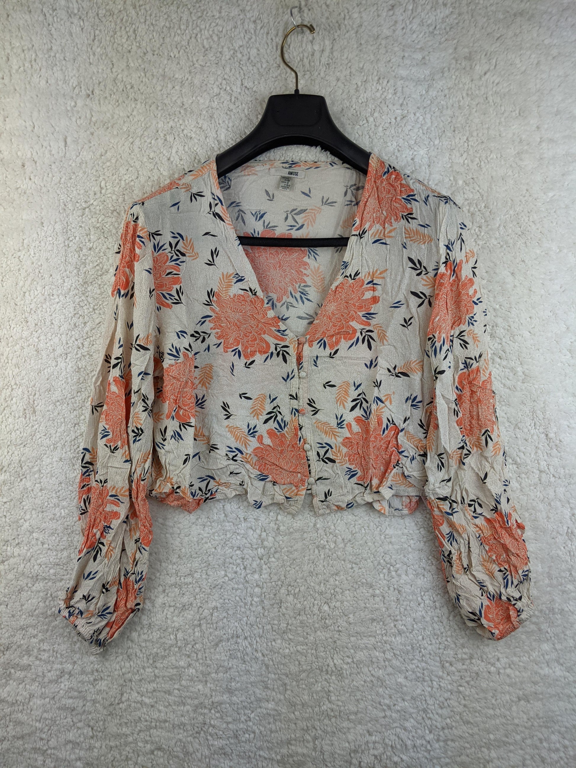 Front view of Amuse Society floral cropped blouse