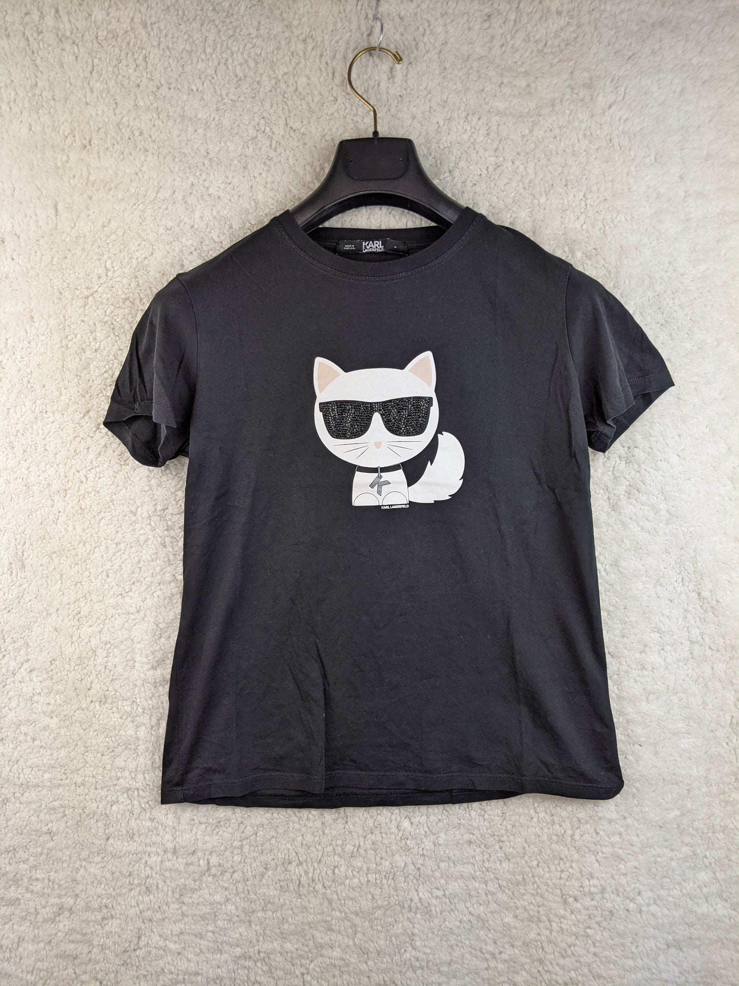 Front view of black T-shirt with cat graphic