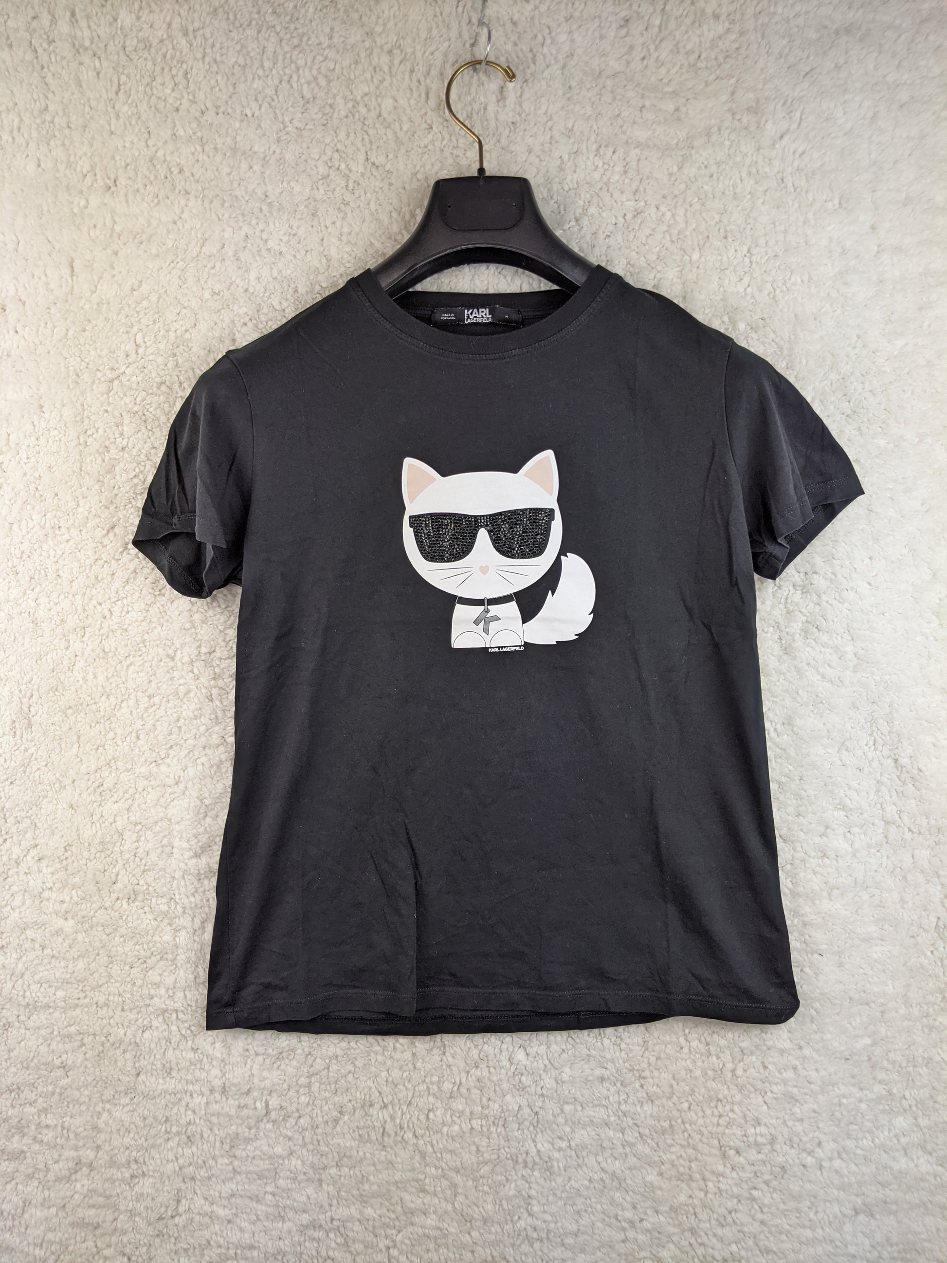Front view of black T-shirt with cat graphic