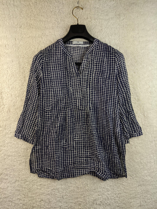 Front view of a Peter Hahn navy and white patterned blouse