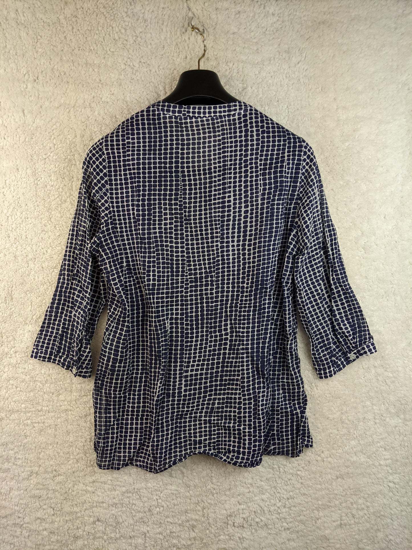 Back view of a Peter Hahn navy and white patterned blouse