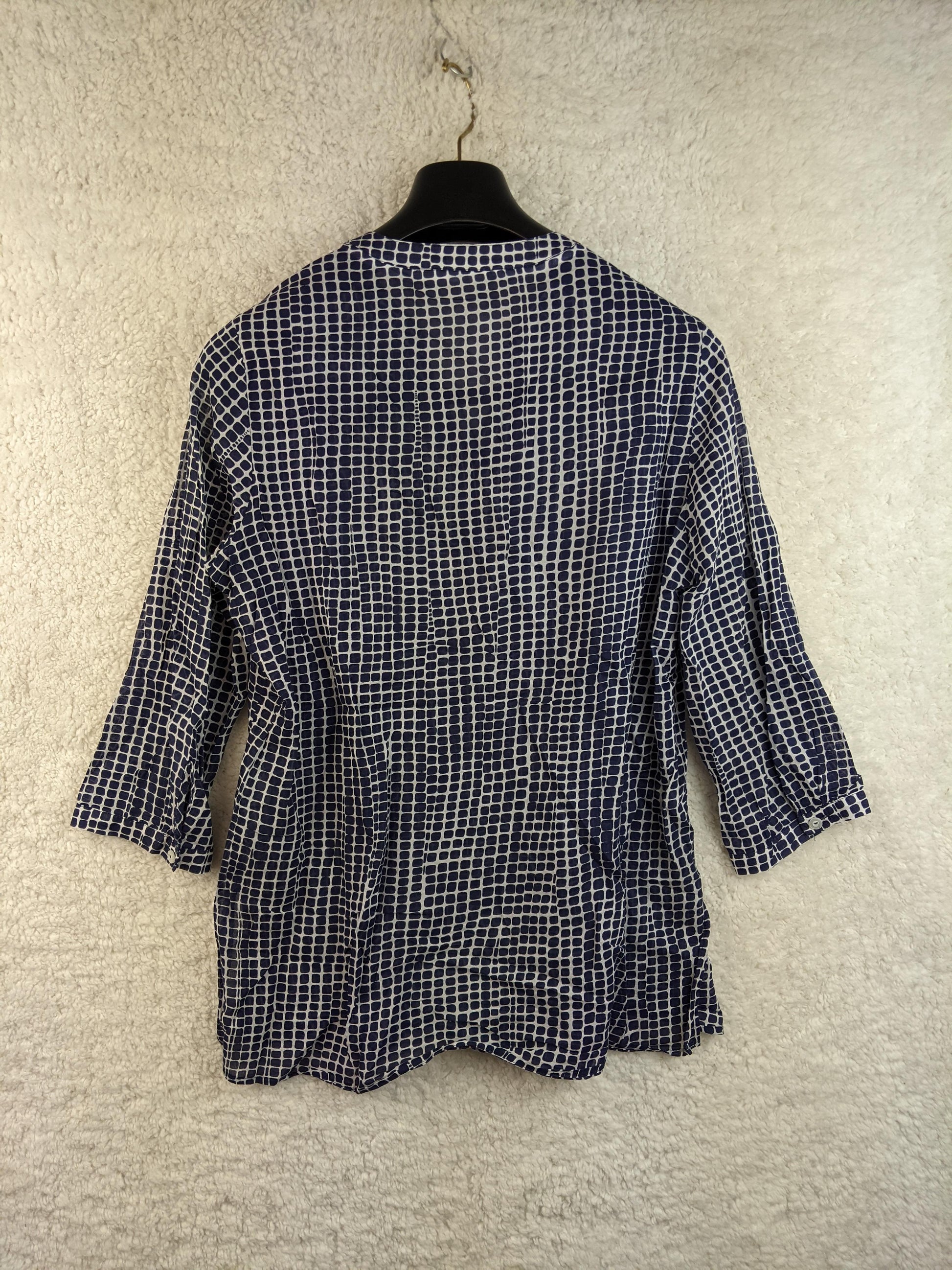 Back view of a Peter Hahn navy and white patterned blouse