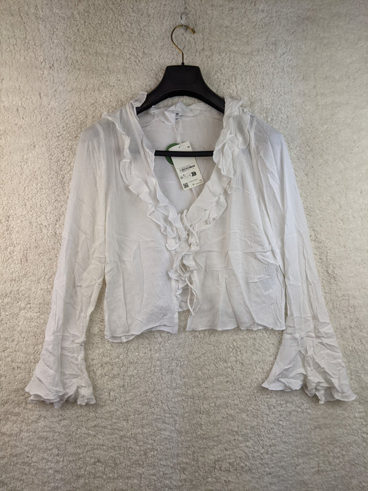 Front view of white ruffled blouse