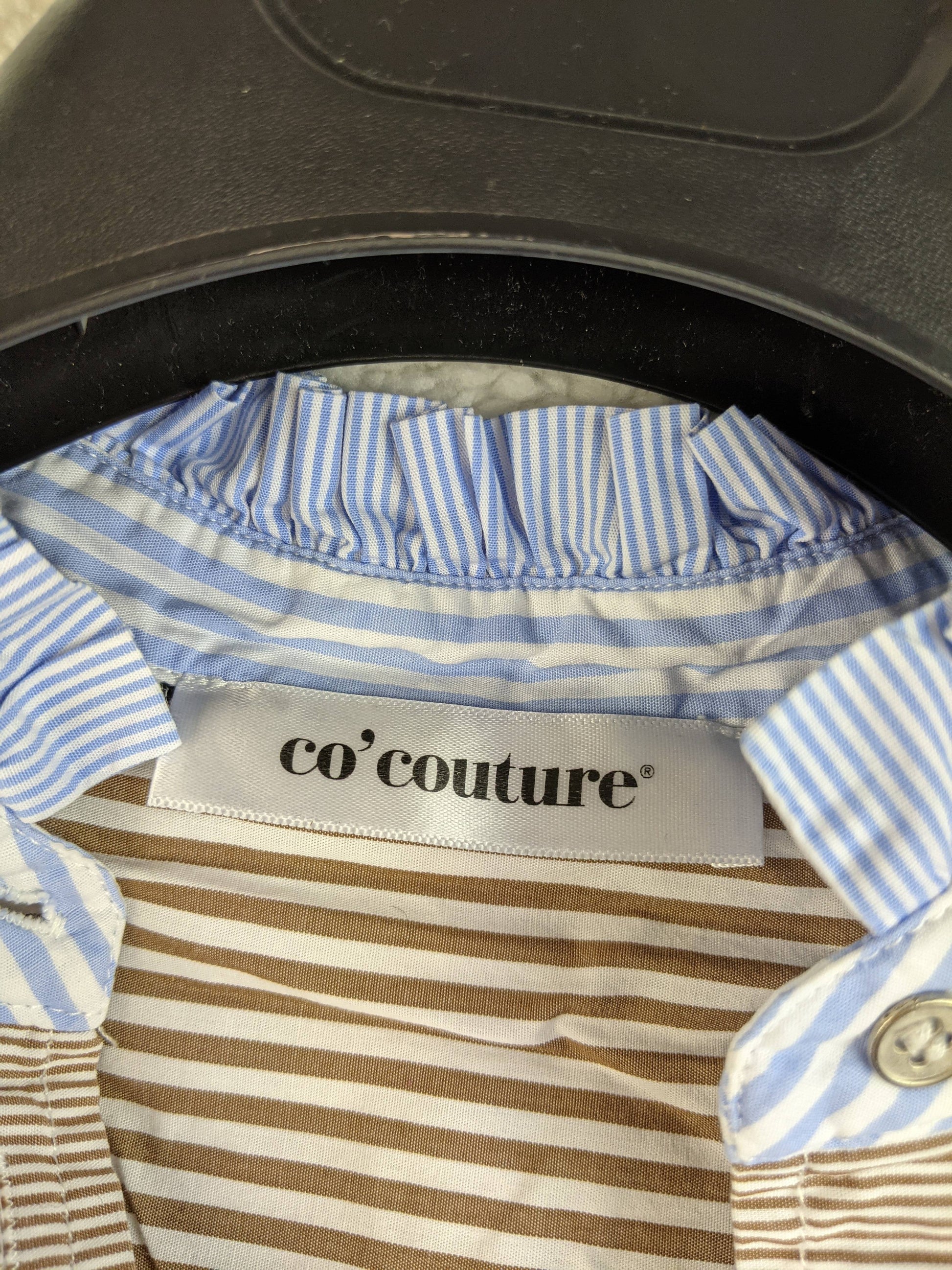 Close-up of Co'couture label