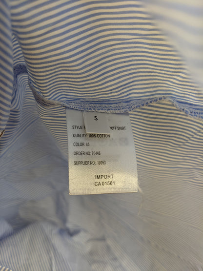 Material tag of Co'couture shirt indicating 100% cotton