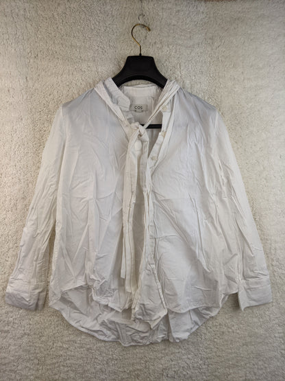 Front view of COS white tie-neck blouse