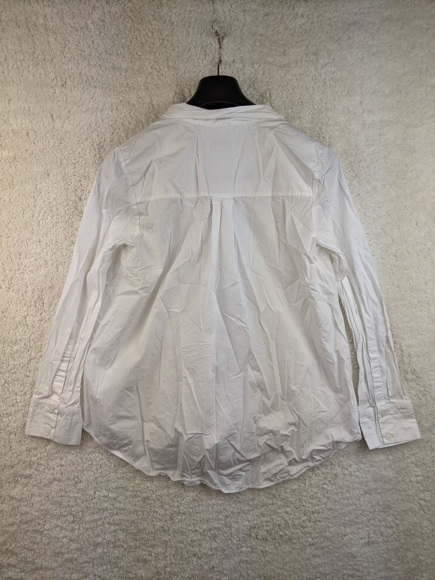 Back view of COS white tie-neck blouse