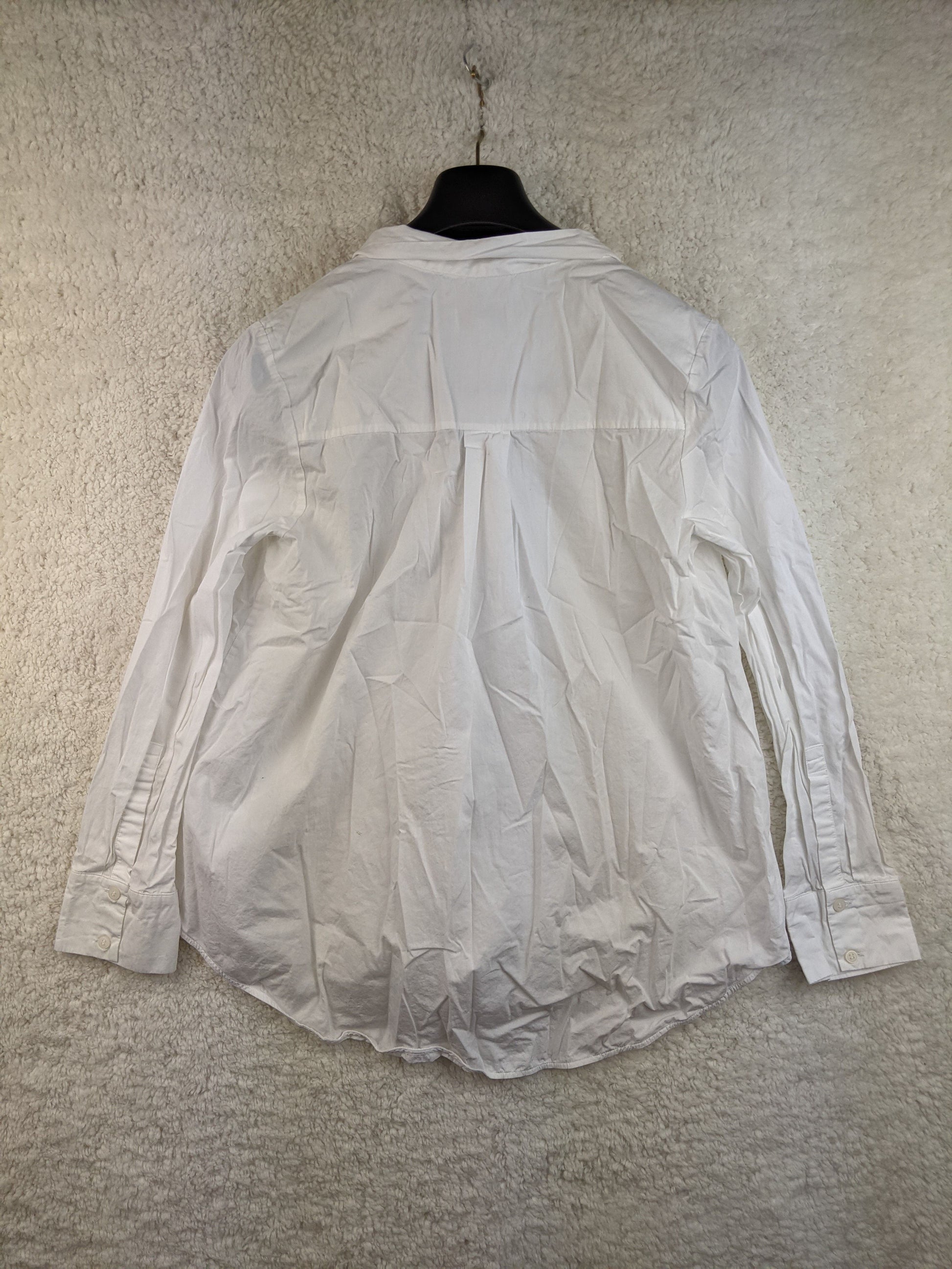 Back view of COS white tie-neck blouse