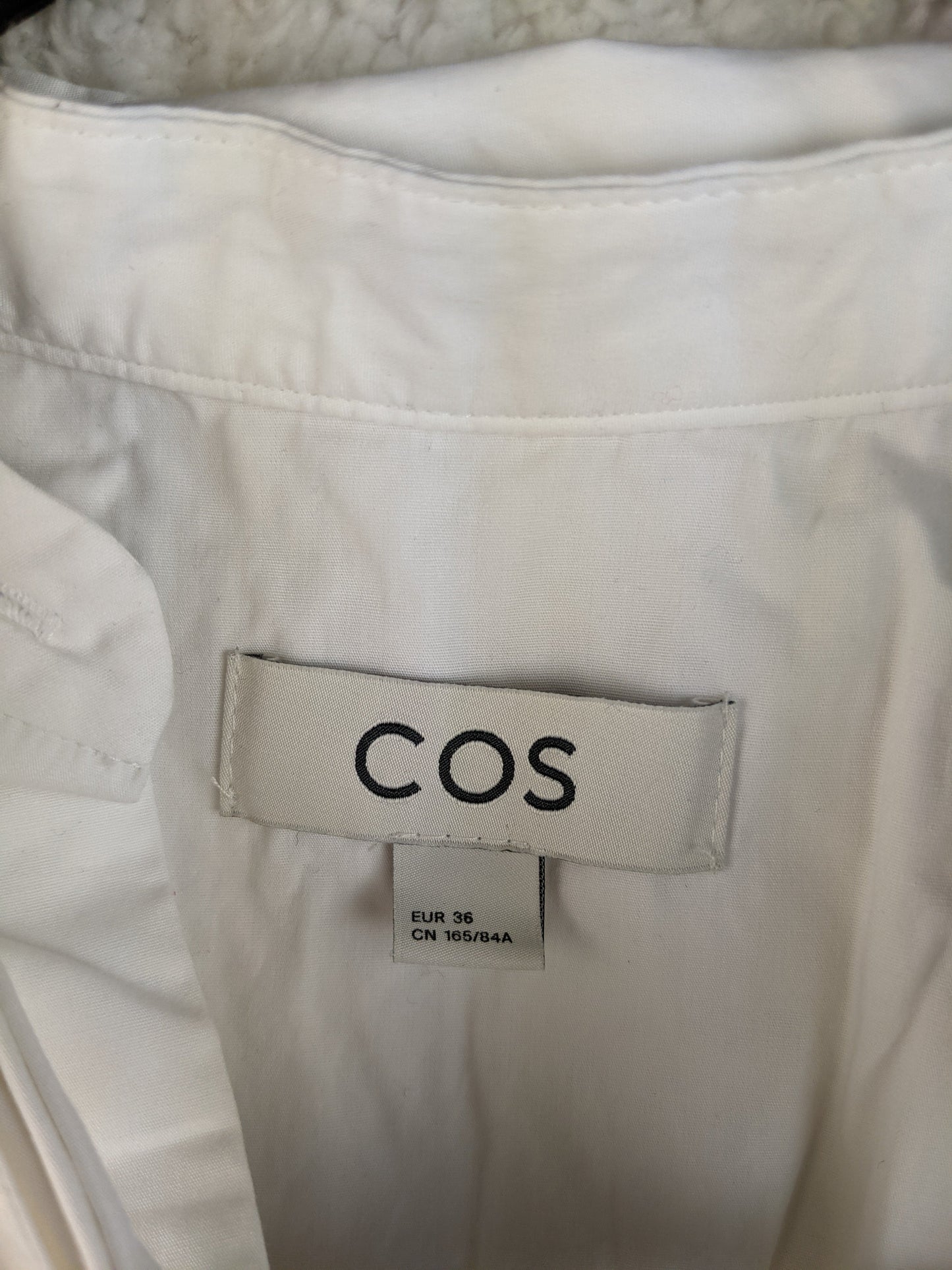 COS brand label showing size 36