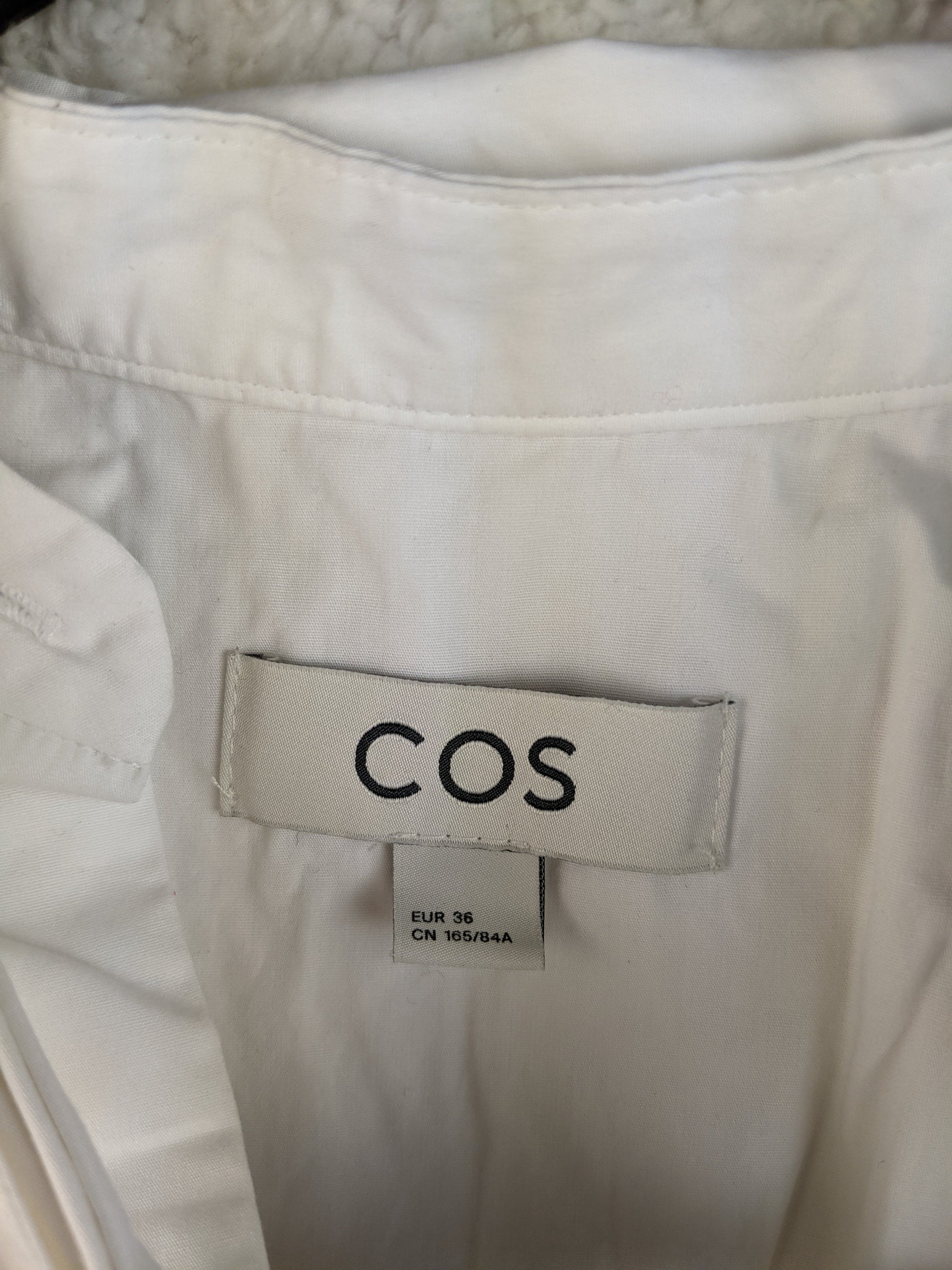 COS brand label showing size 36