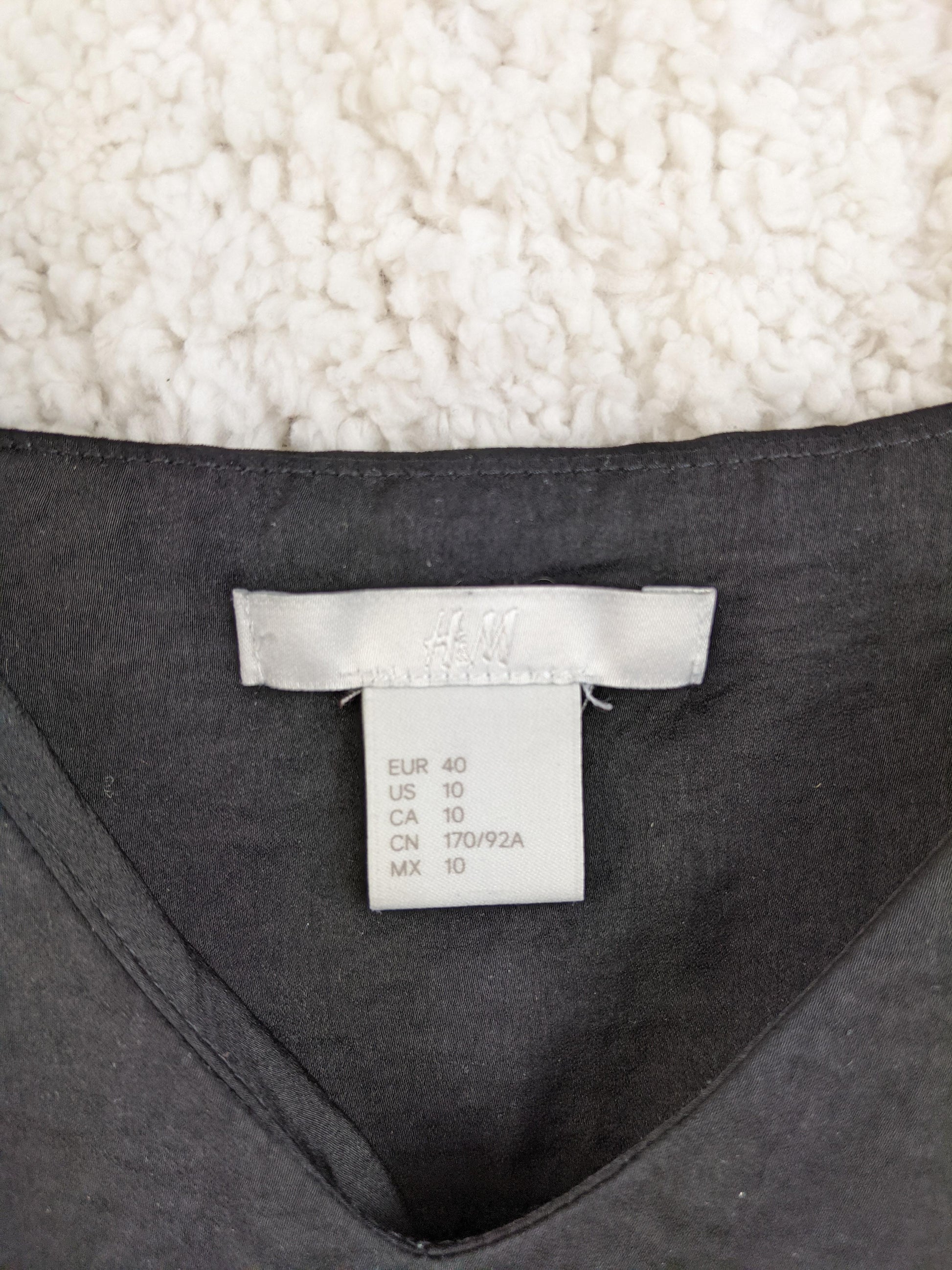 Label of H&M camisole showing size and brand