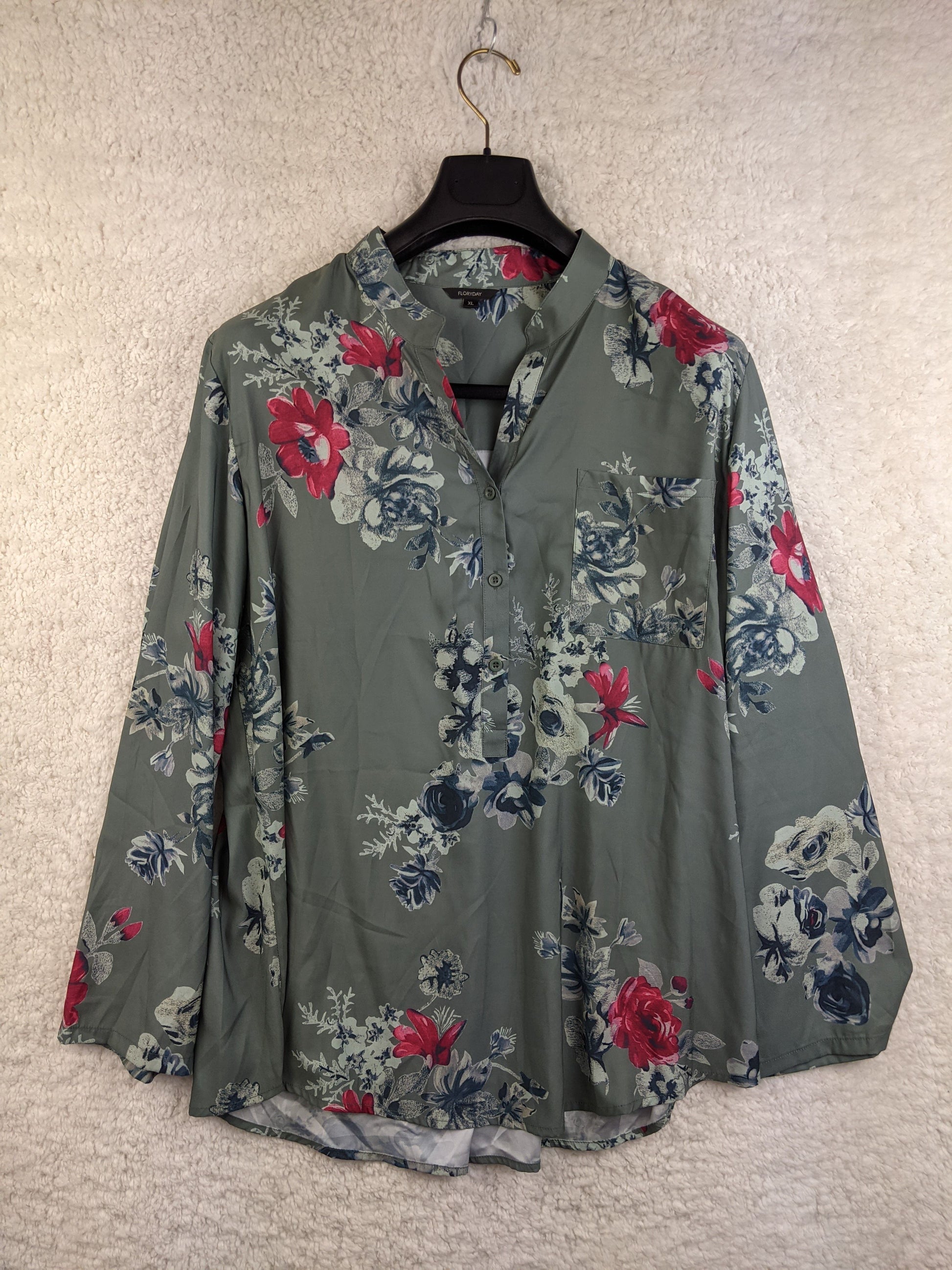 Front view of green floral blouse