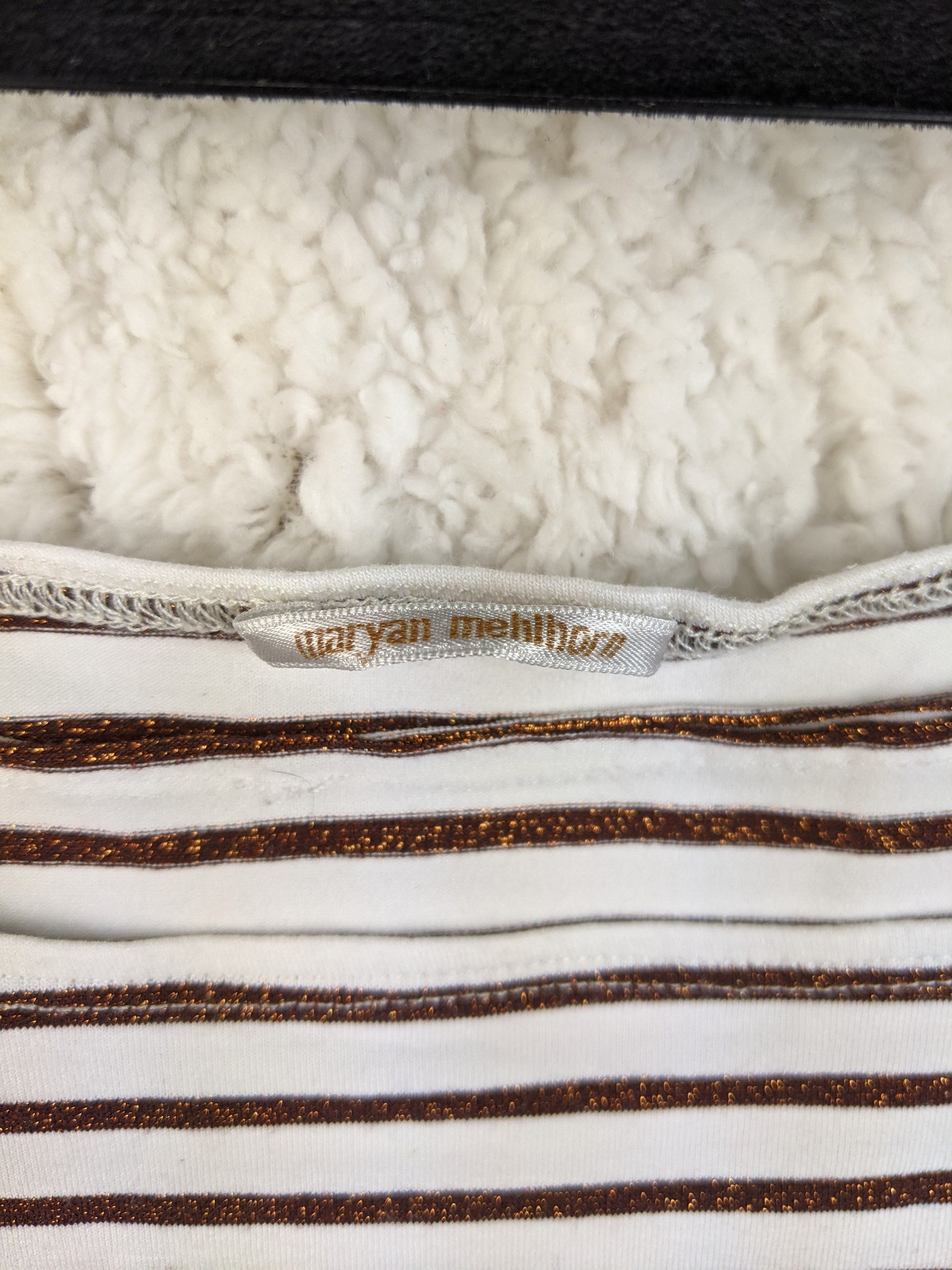 Close-up of the brand label on the tank top