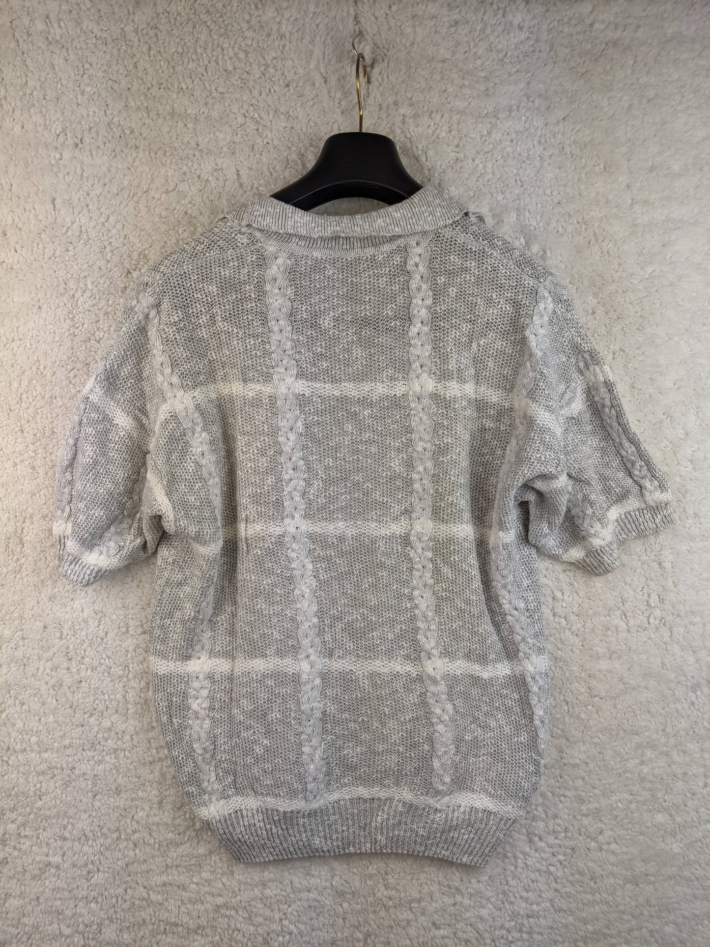 Back view of a vintage gray short-sleeve knit top