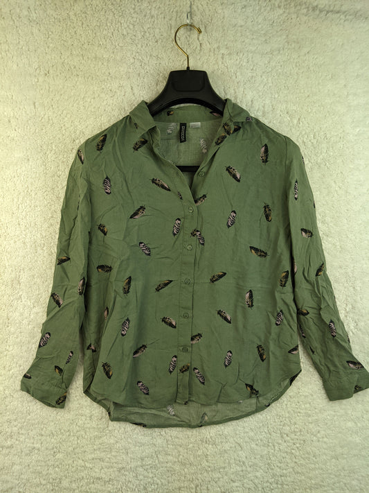 Front view of green feather print shirt