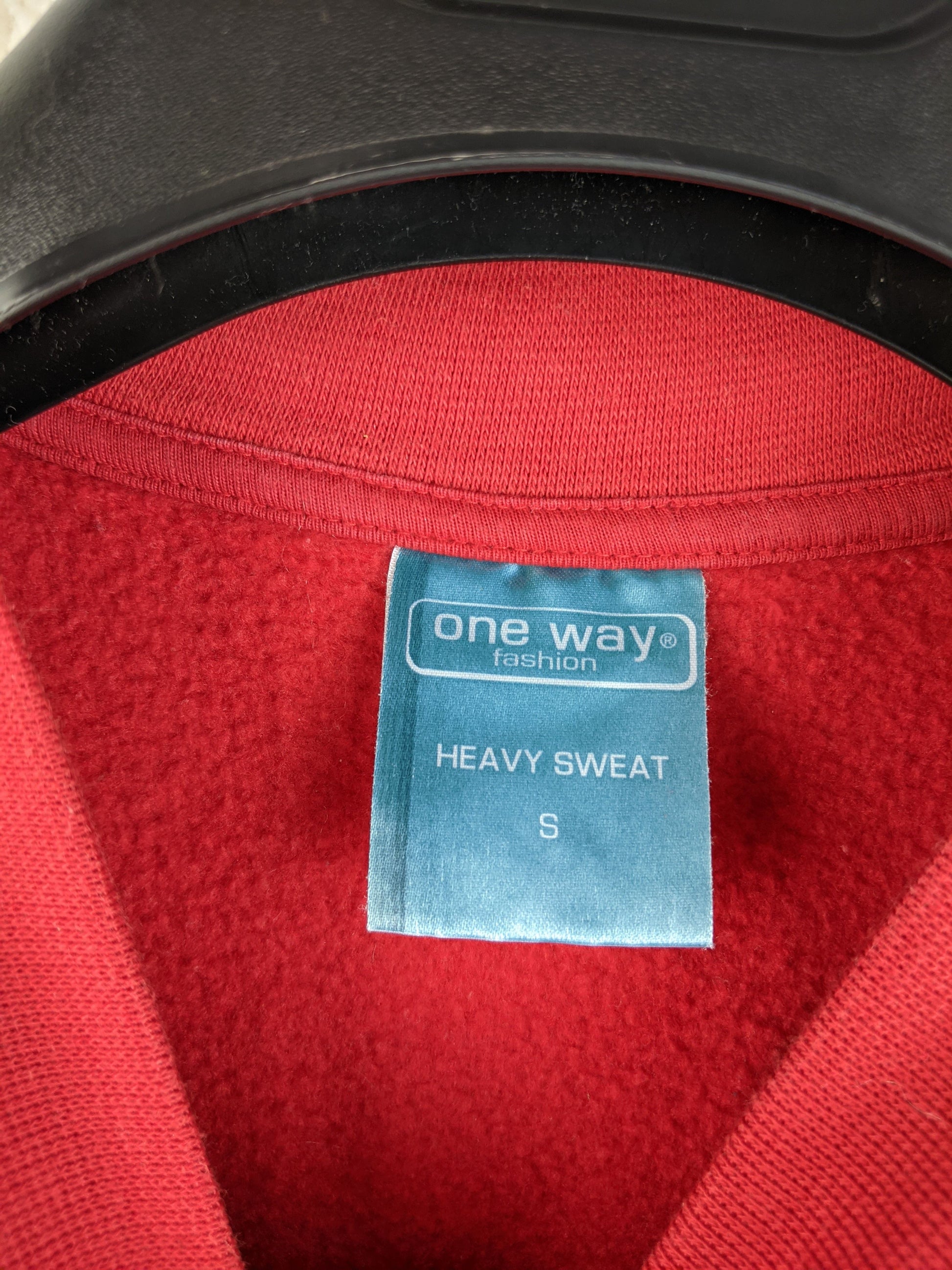 Label of One Way Fashion red sweater