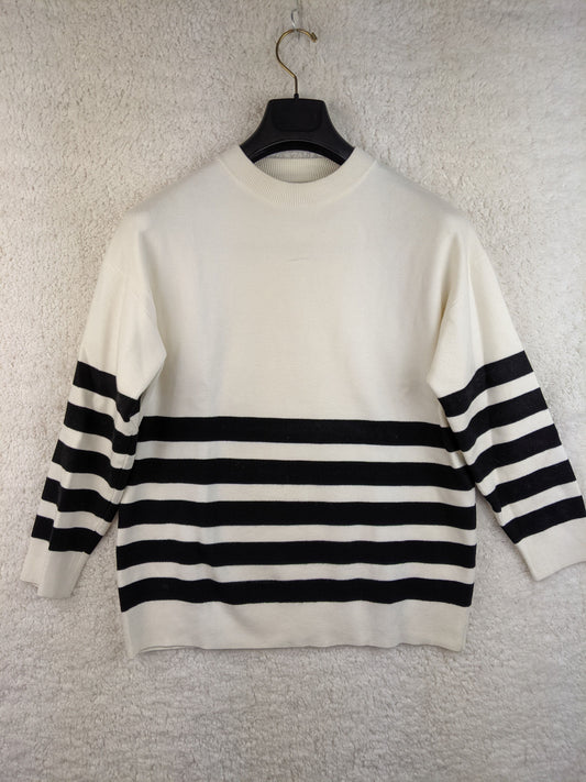 Front view of MNG black and white striped sweater
