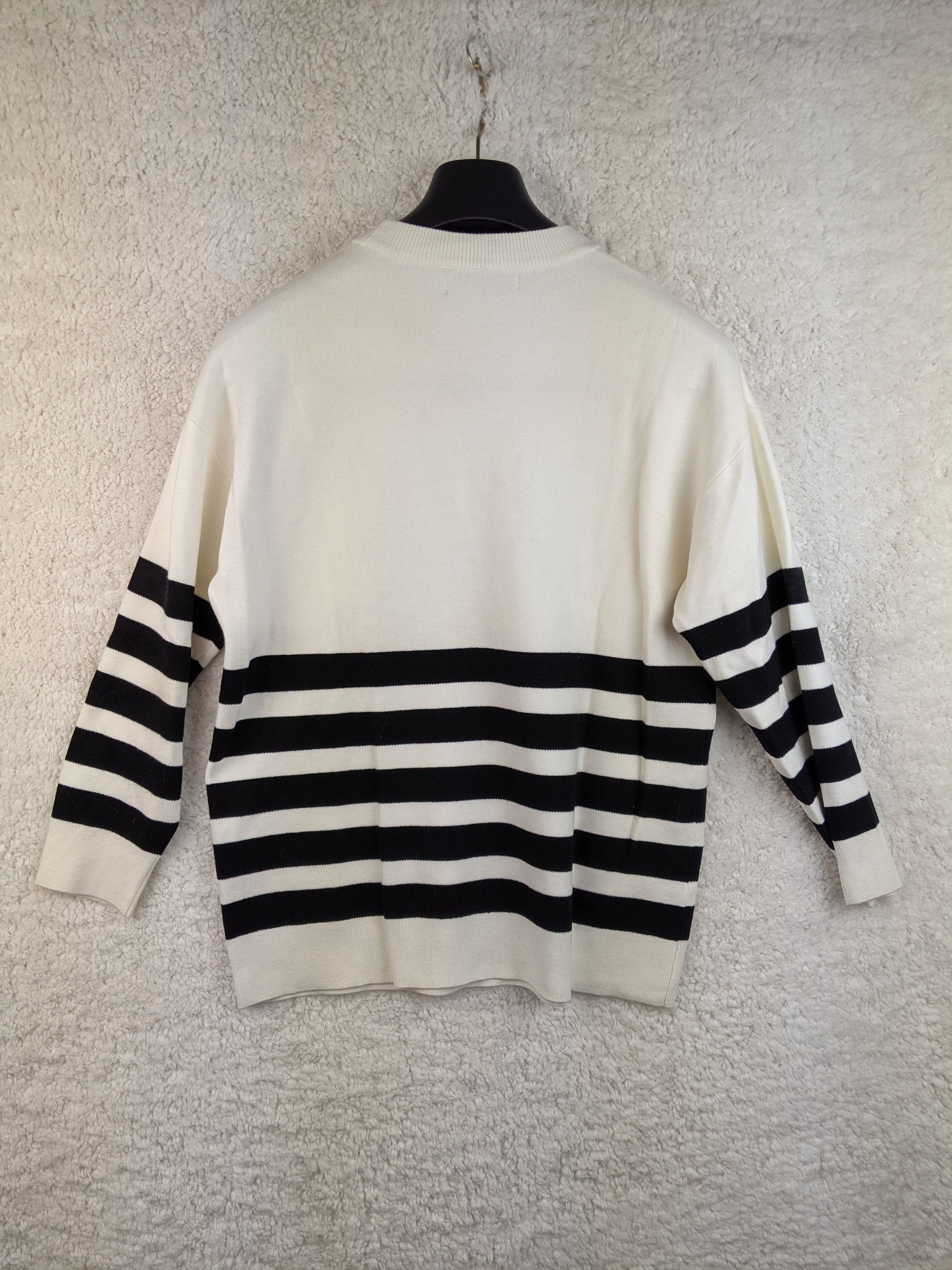 Back view of MNG black and white striped sweater