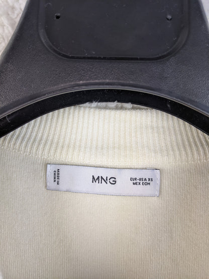 Close-up of MNG label on sweater