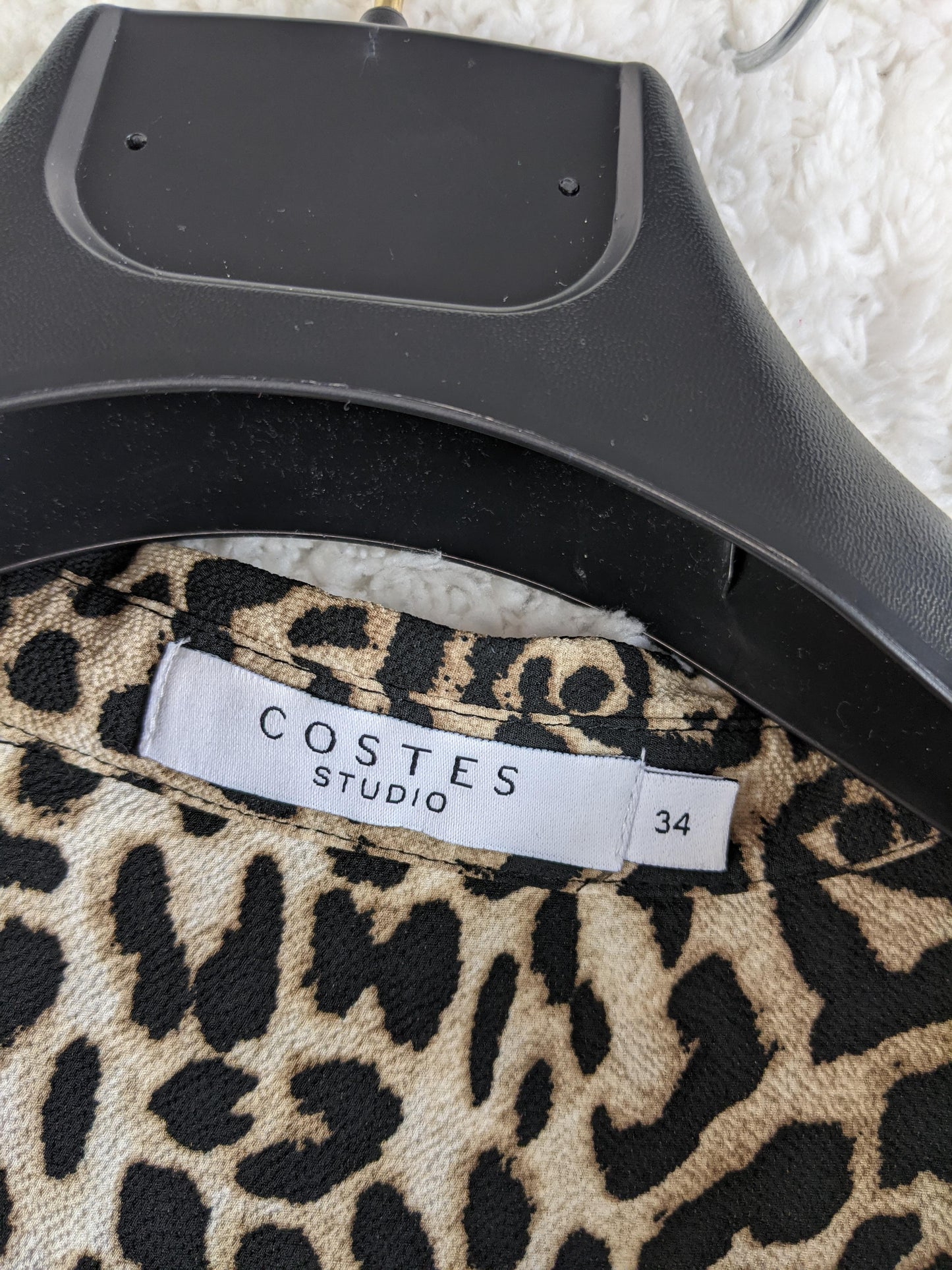 Label showing Costes Studio brand and size 34