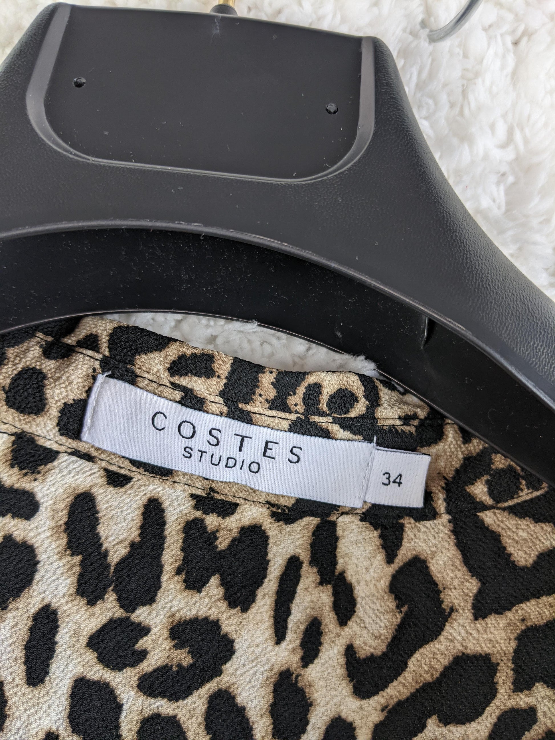 Label showing Costes Studio brand and size 34