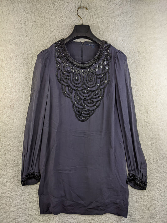 Front view of black beaded tunic dress