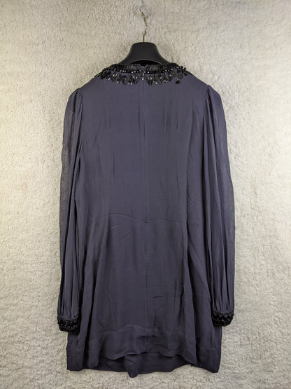 Back view of black beaded tunic dress