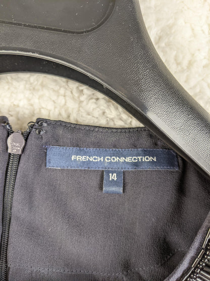 Close-up of French Connection label and size tag
