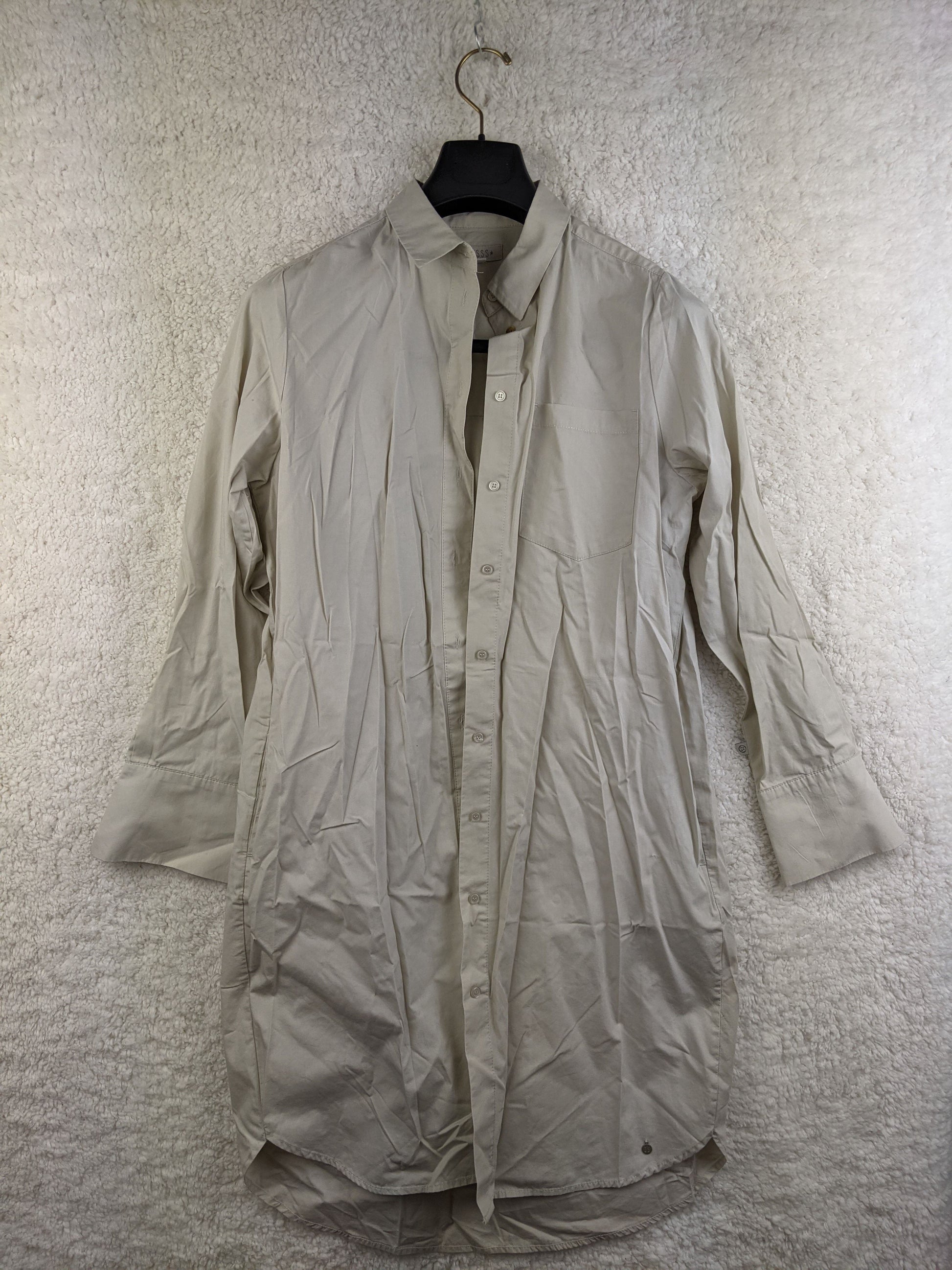 Front view of beige long sleeve shirt dress