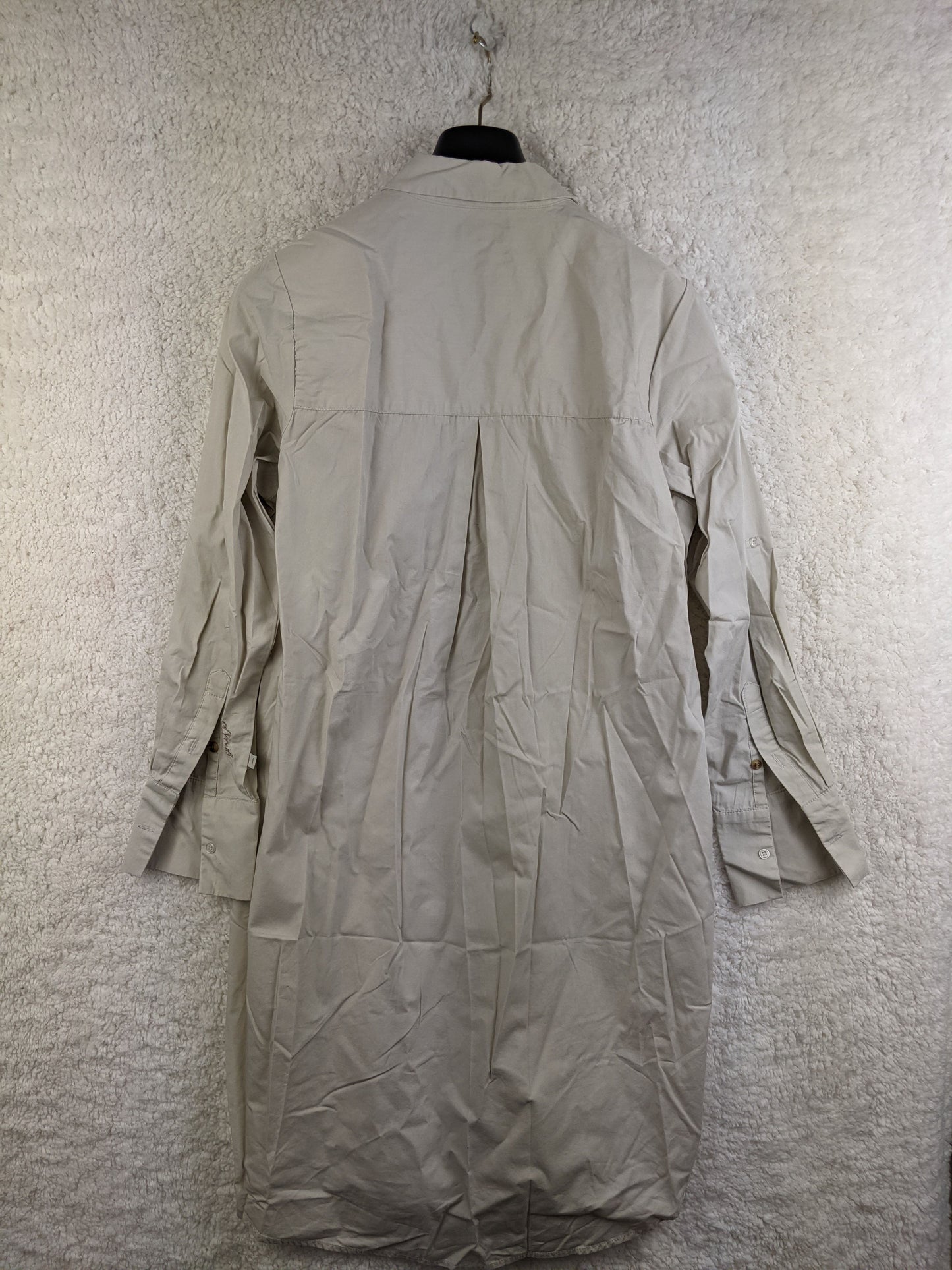 Back view of beige long sleeve shirt dress