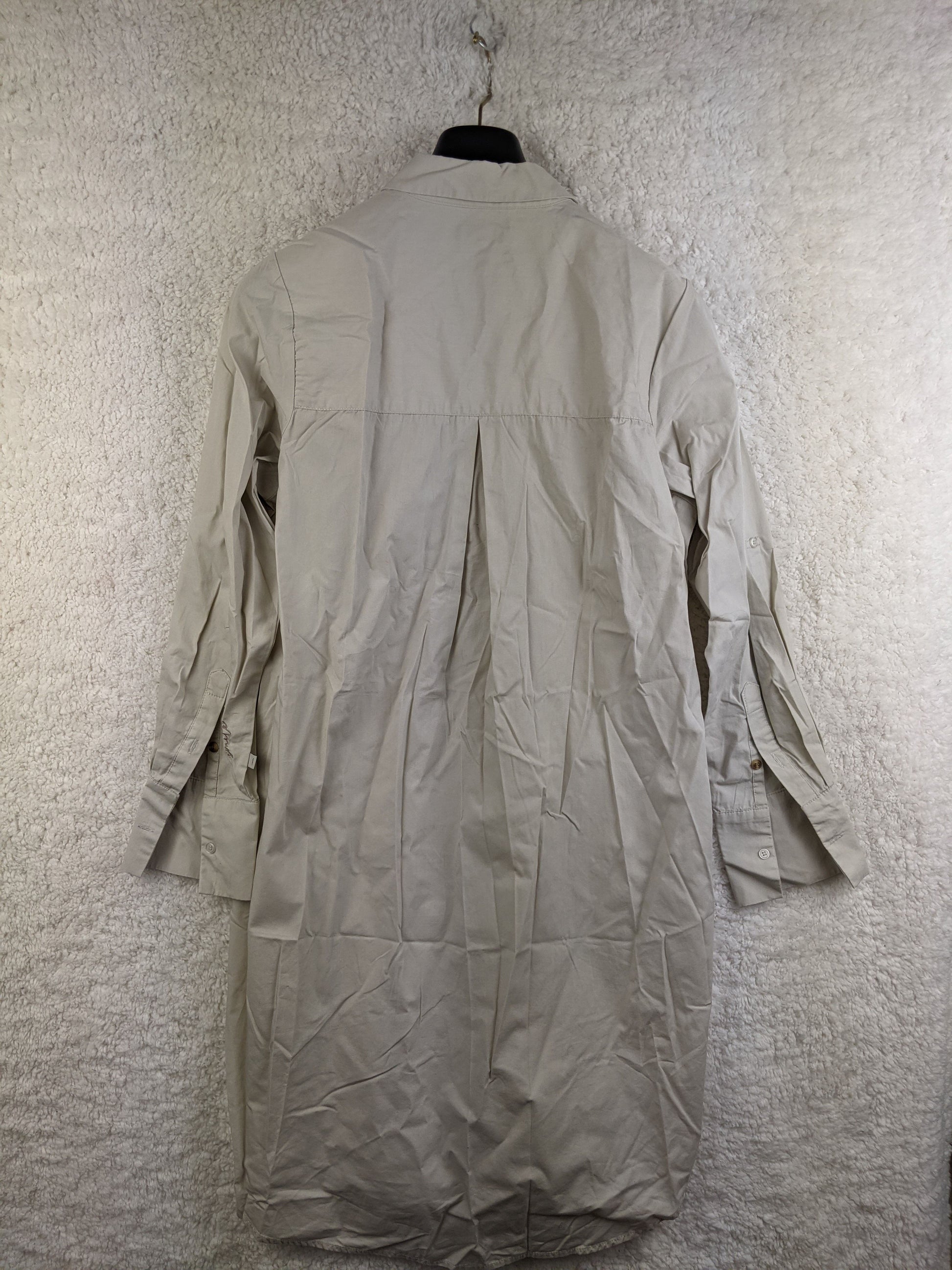Back view of beige long sleeve shirt dress
