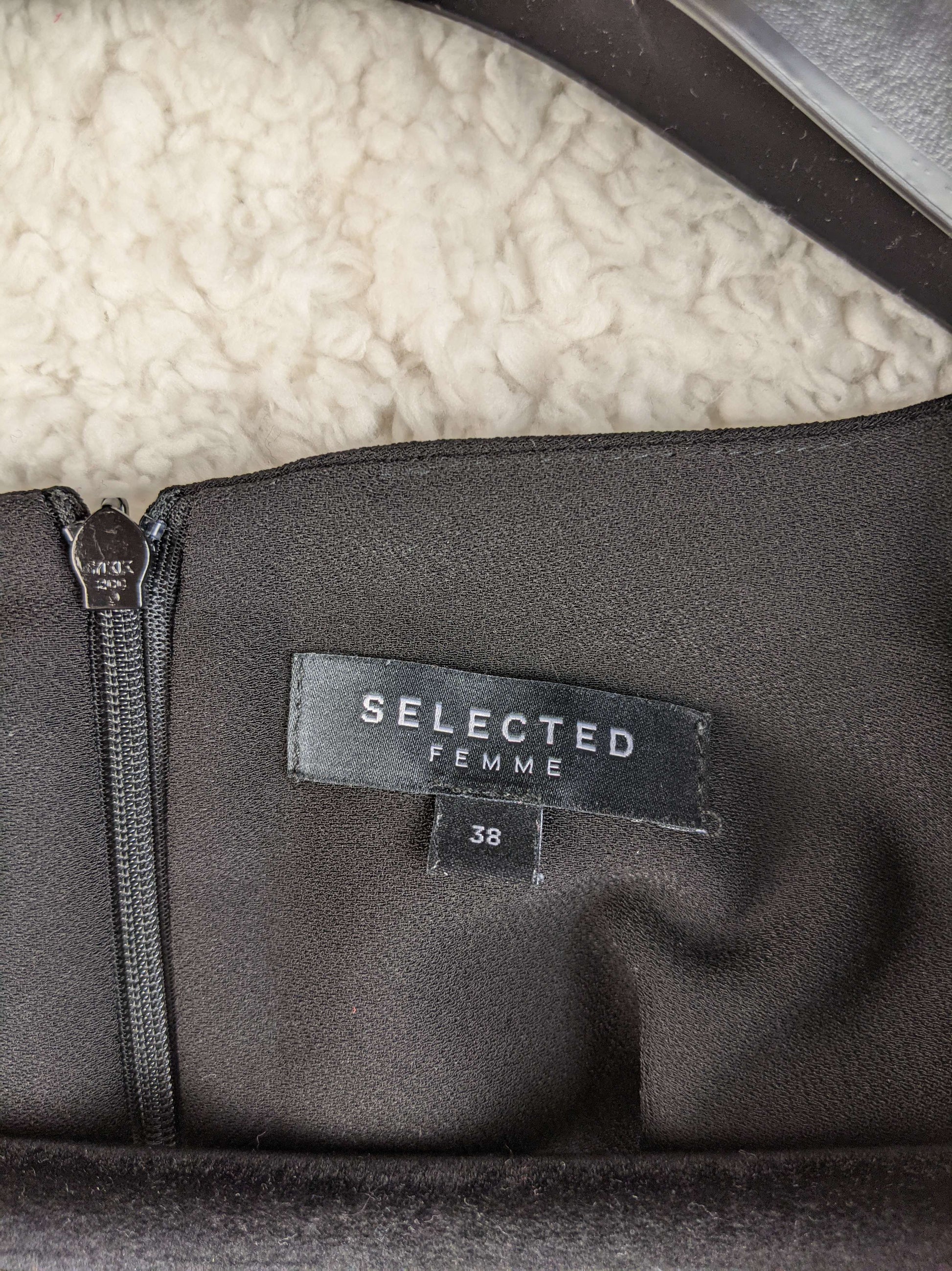 Close-up of Selected Femme label on dress