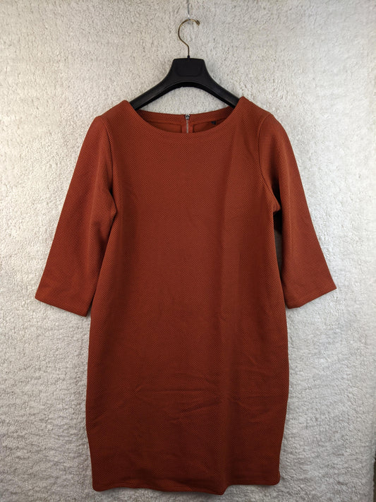 Front view of burnt orange knee-length dress